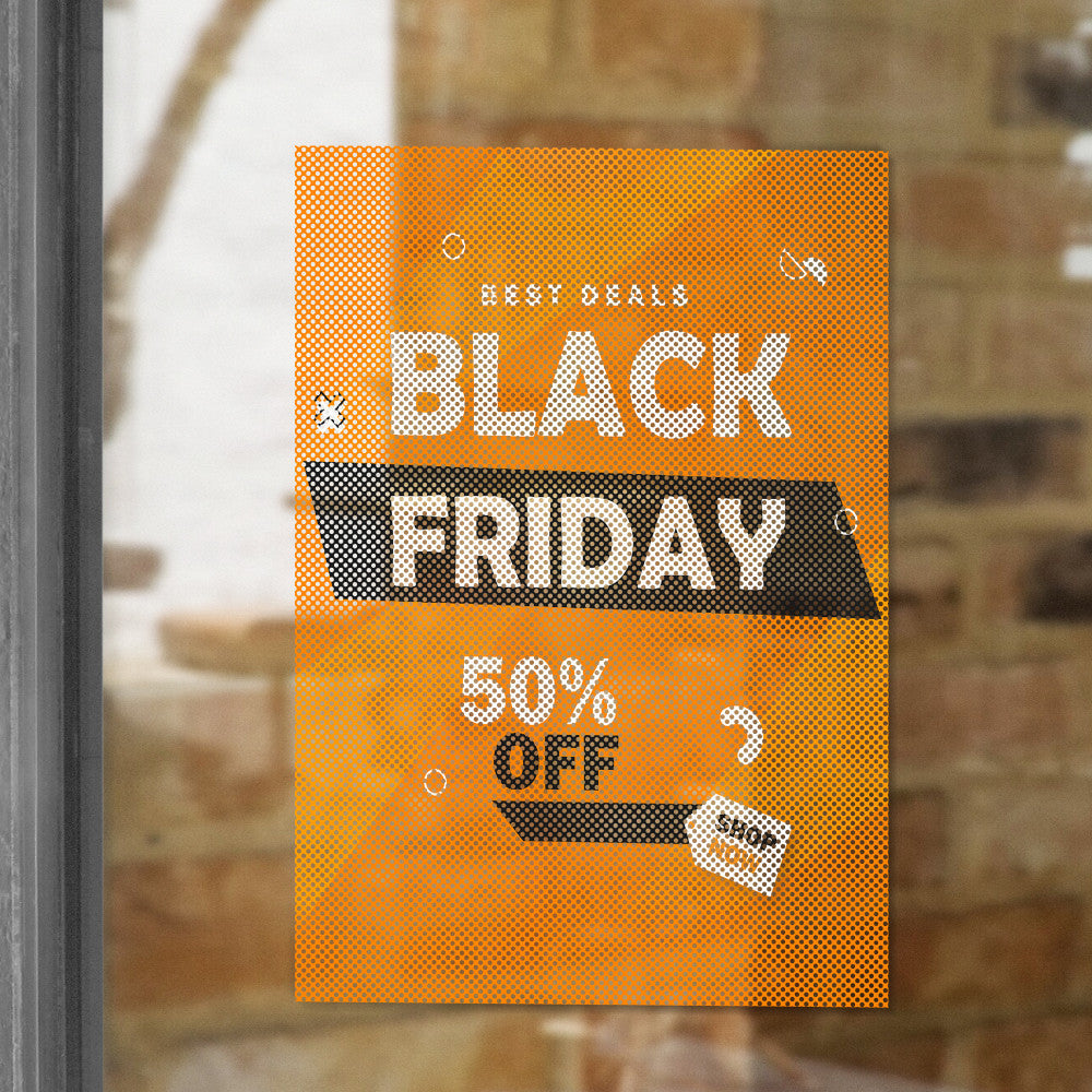 Custom printed perforated window film with Black Friday sale design, applied to storefront glass for promotional advertising.